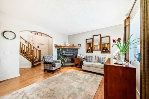 198 Brightonstone Bay Se, Calgary, AB - Indoor Photo Showing Living Room With Fireplace