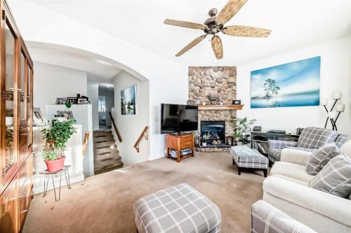 198 Brightonstone Bay Se, Calgary, AB - Indoor Photo Showing Living Room With Fireplace