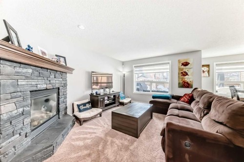 562 New Brighton Drive Se, Calgary, AB - Indoor Photo Showing Living Room With Fireplace