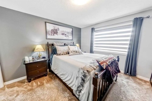 562 New Brighton Drive Se, Calgary, AB - Indoor Photo Showing Bedroom