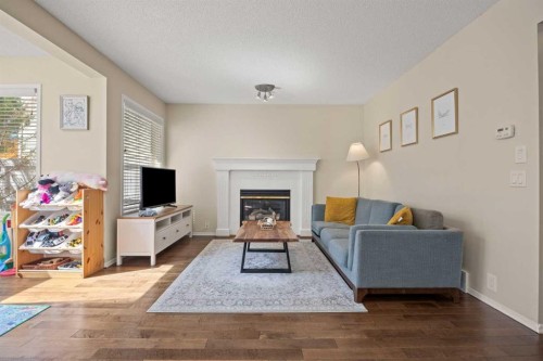 71 Somercrest Close Sw, Calgary, AB - Indoor Photo Showing Living Room With Fireplace