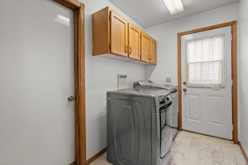 132 Scenic Cove Circle Nw, Calgary, AB - Indoor Photo Showing Laundry Room