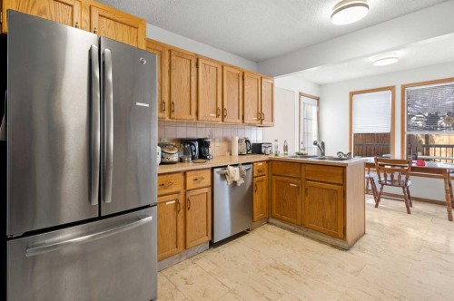 132 Scenic Cove Circle Nw, Calgary, AB - Indoor Photo Showing Kitchen With Double Sink