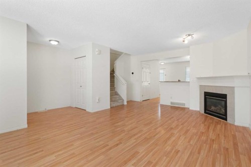 119 Royal Birch Villas Nw, Calgary, AB - Indoor Photo Showing Living Room With Fireplace