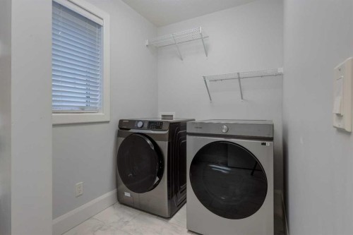 37 Cattail Run, Rural Rocky View County, AB - Indoor Photo Showing Laundry Room
