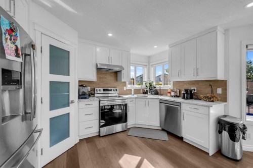 80 Canoe Square Sw, Airdrie, AB - Indoor Photo Showing Kitchen With Double Sink