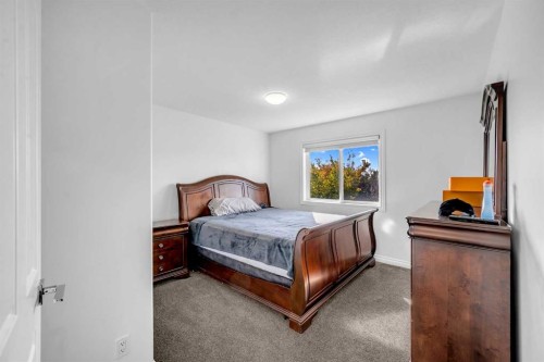80 Canoe Square Sw, Airdrie, AB - Indoor Photo Showing Bedroom