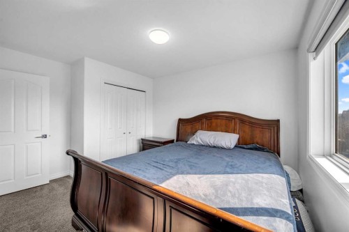 80 Canoe Square Sw, Airdrie, AB - Indoor Photo Showing Bedroom
