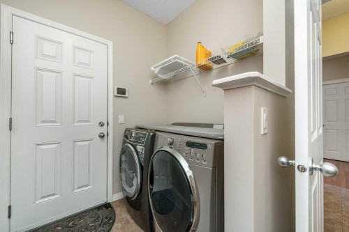 1119 Panamount Boulevard Nw, Calgary, AB - Indoor Photo Showing Laundry Room