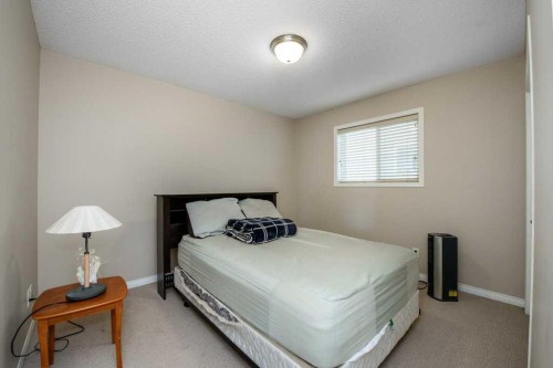 1119 Panamount Boulevard Nw, Calgary, AB - Indoor Photo Showing Bedroom