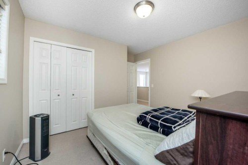 1119 Panamount Boulevard Nw, Calgary, AB - Indoor Photo Showing Bedroom