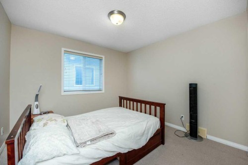 1119 Panamount Boulevard Nw, Calgary, AB - Indoor Photo Showing Bedroom