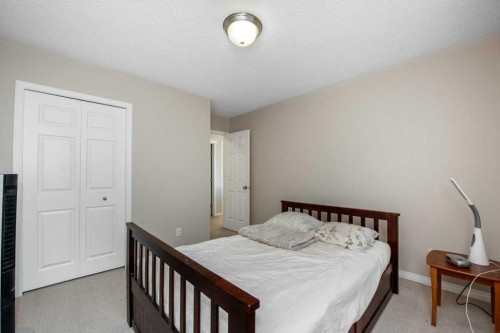 1119 Panamount Boulevard Nw, Calgary, AB - Indoor Photo Showing Bedroom