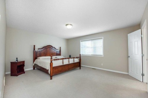 1119 Panamount Boulevard Nw, Calgary, AB - Indoor Photo Showing Bedroom