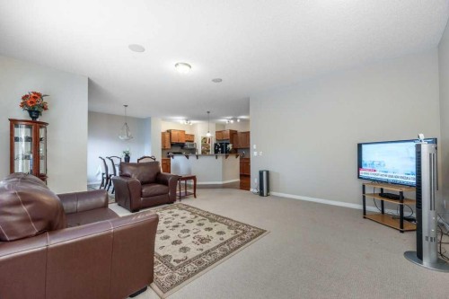1119 Panamount Boulevard Nw, Calgary, AB - Indoor Photo Showing Living Room