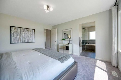 103 Wolf Creek Rise Se, Calgary, AB - Indoor Photo Showing Bedroom