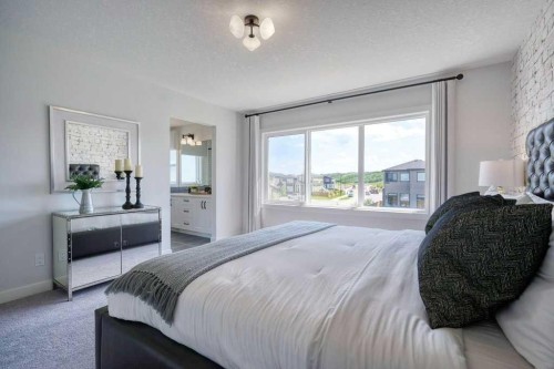103 Wolf Creek Rise Se, Calgary, AB - Indoor Photo Showing Bedroom