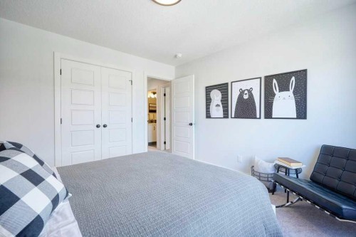 103 Wolf Creek Rise Se, Calgary, AB - Indoor Photo Showing Bedroom
