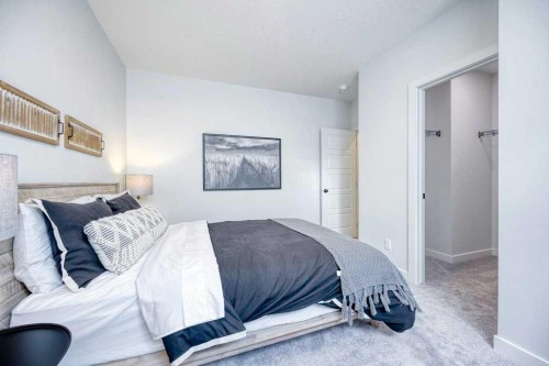 103 Wolf Creek Rise Se, Calgary, AB - Indoor Photo Showing Bedroom