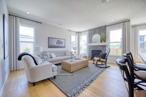 103 Wolf Creek Rise Se, Calgary, AB - Indoor Photo Showing Living Room With Fireplace