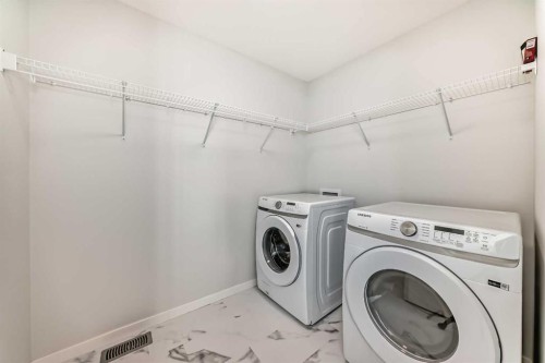 129-42 Cranbrook Gardens Se, Calgary, AB - Indoor Photo Showing Laundry Room