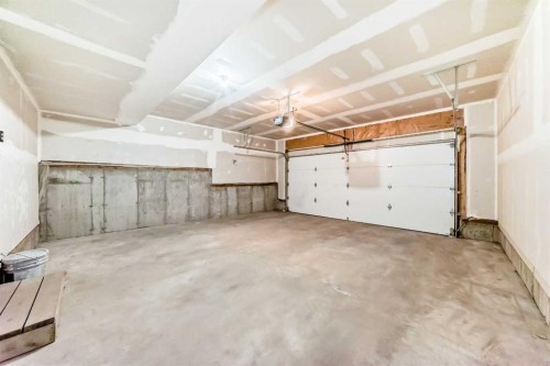 129-42 Cranbrook Gardens Se, Calgary, AB - Indoor Photo Showing Garage