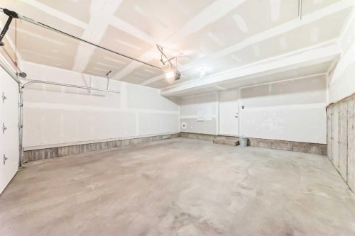 129-42 Cranbrook Gardens Se, Calgary, AB - Indoor Photo Showing Garage