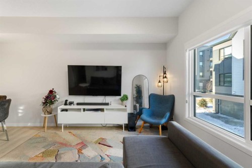 405 20295 Seton Way Se, Calgary, AB - Indoor Photo Showing Living Room