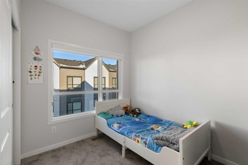 405 20295 Seton Way Se, Calgary, AB - Indoor Photo Showing Bedroom