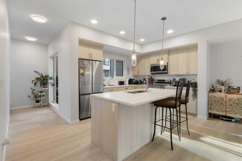 405 20295 Seton Way Se, Calgary, AB - Indoor Photo Showing Kitchen With Stainless Steel Kitchen With Double Sink With Upgraded Kitchen