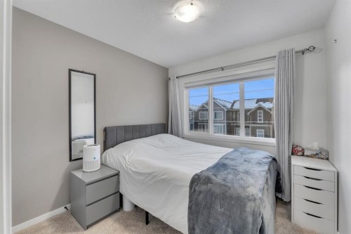 128 Seton Villas Se, Calgary, AB - Indoor Photo Showing Bedroom