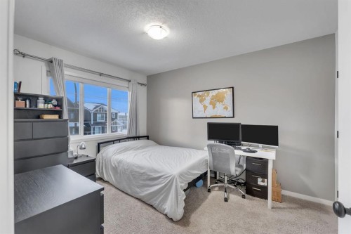 128 Seton Villas Se, Calgary, AB - Indoor Photo Showing Bedroom