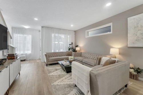 128 Seton Villas Se, Calgary, AB - Indoor Photo Showing Living Room