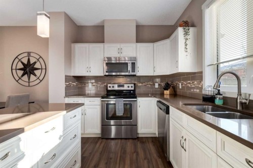 161 Mahogany Drive Se, Calgary, AB - Indoor Photo Showing Kitchen With Stainless Steel Kitchen With Double Sink With Upgraded Kitchen