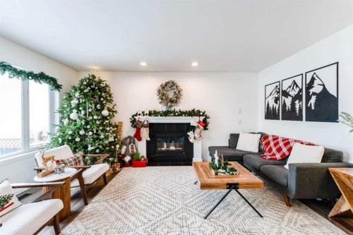 147 Chaparral Ridge Circle Se, Calgary, AB - Indoor Photo Showing Living Room With Fireplace