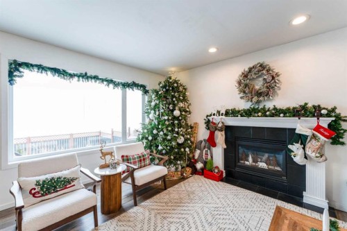 147 Chaparral Ridge Circle Se, Calgary, AB - Indoor Photo Showing Living Room With Fireplace