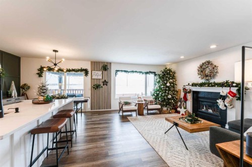 147 Chaparral Ridge Circle Se, Calgary, AB - Indoor Photo Showing Living Room With Fireplace