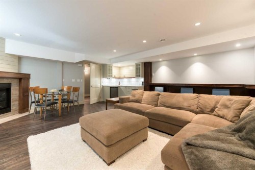 4826 Bowness Road Nw, Calgary, AB - Indoor Photo Showing Living Room With Fireplace