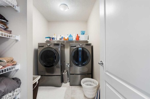 229 Kingsbury Close Se, Airdrie, AB - Indoor Photo Showing Laundry Room