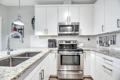 3306-522 Cranford Drive Se, Calgary, AB - Indoor Photo Showing Kitchen With Stainless Steel Kitchen With Double Sink With Upgraded Kitchen