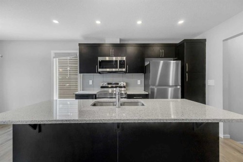 1383 148 Avenue Nw, Calgary, AB - Indoor Photo Showing Kitchen With Double Sink With Upgraded Kitchen