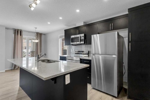 1383 148 Avenue Nw, Calgary, AB - Indoor Photo Showing Kitchen With Double Sink With Upgraded Kitchen