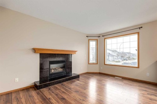 8 Canoe Circle Sw, Airdrie, AB - Indoor Photo Showing Living Room With Fireplace