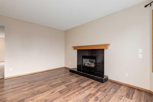 8 Canoe Circle Sw, Airdrie, AB - Indoor Photo Showing Living Room With Fireplace
