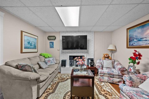 2220 38 Street Sw, Calgary, AB - Indoor Photo Showing Living Room With Fireplace