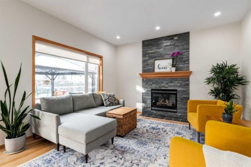13 Bow Ridge Link, Cochrane, AB - Indoor Photo Showing Living Room With Fireplace