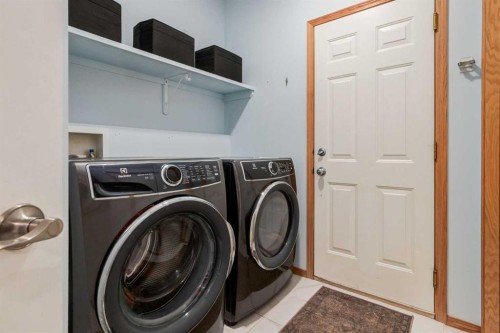 13 Bow Ridge Link, Cochrane, AB - Indoor Photo Showing Laundry Room