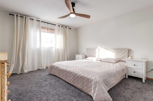 13 Bow Ridge Link, Cochrane, AB - Indoor Photo Showing Bedroom