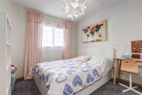 13 Bow Ridge Link, Cochrane, AB - Indoor Photo Showing Bedroom