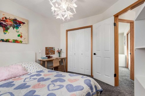 13 Bow Ridge Link, Cochrane, AB - Indoor Photo Showing Bedroom
